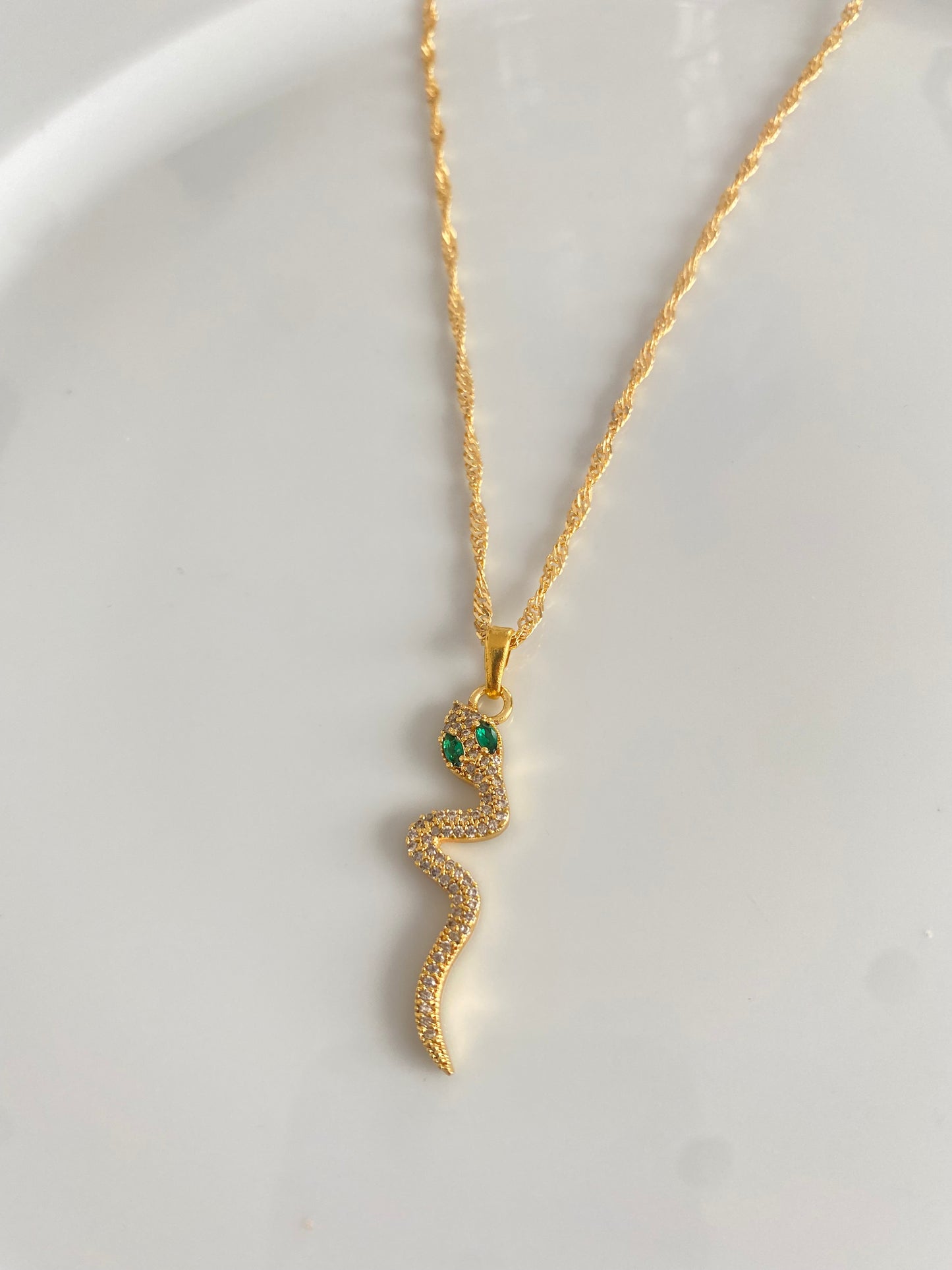 Green eyed snake necklace